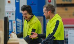 VIP Frames & Trusses staff working in the factory, laughing