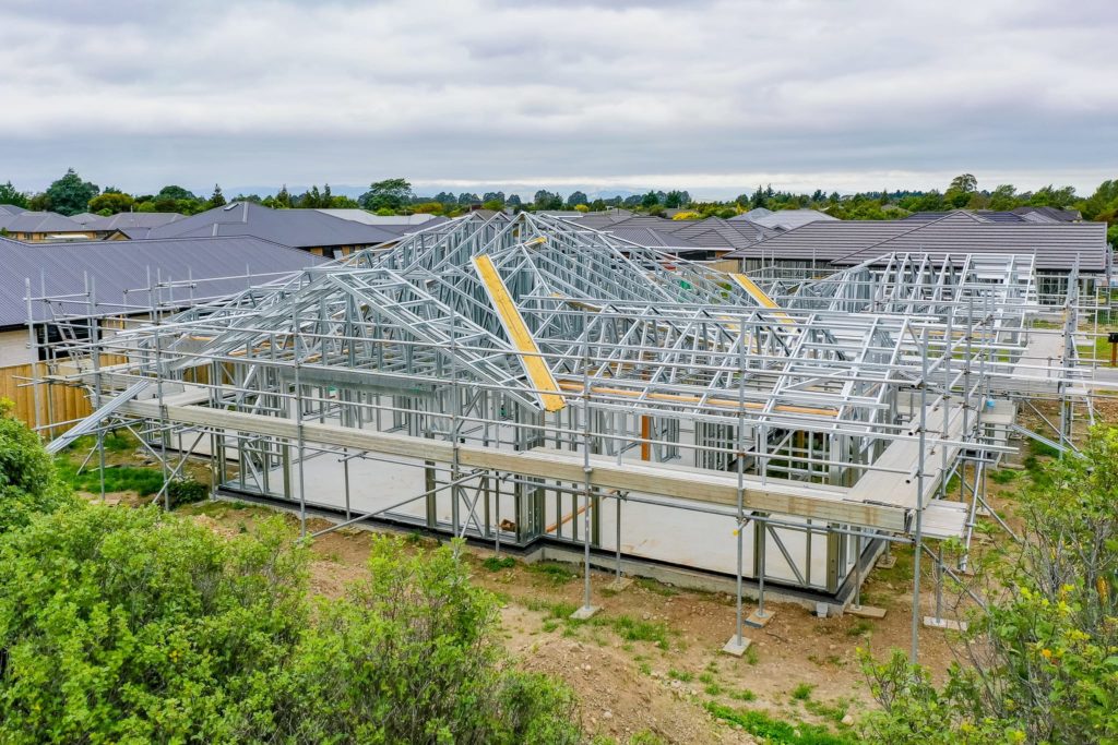 Drone photo of steel framing and trusses installed on site for a house build