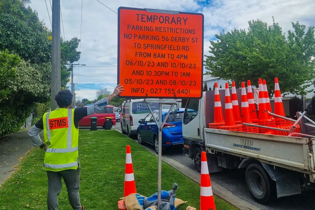 Image of staff holding traffic sign for VIP Frames and Trusses Traffic Management service